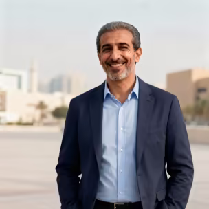 Smiling man in a blazer, representing an individual insurance customer